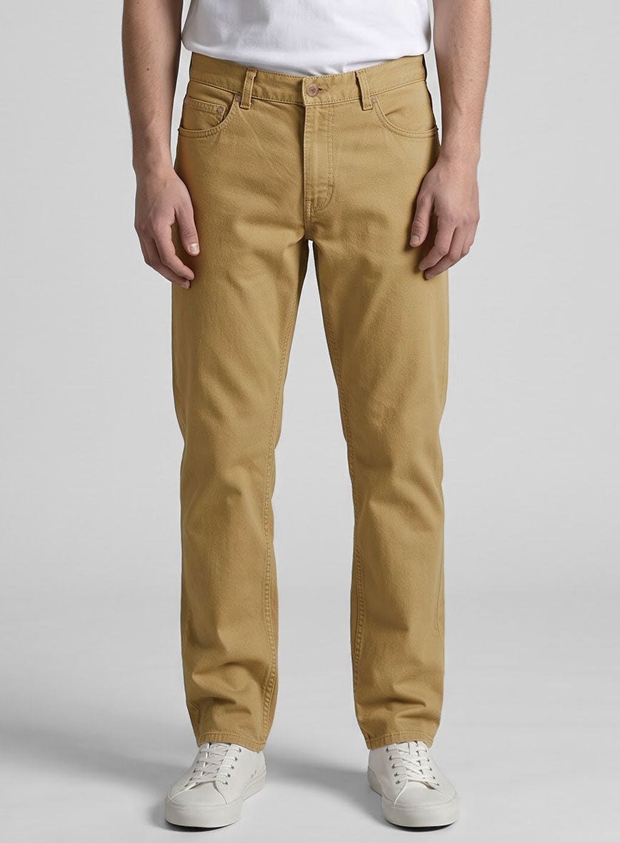Front view of a man wearing khaki stretch chino jeans, five-pocket style