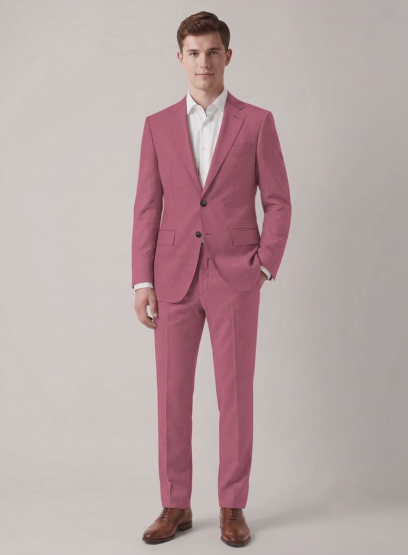 Man wearing a pink wool suit with two-button jacket and brown shoes, front view