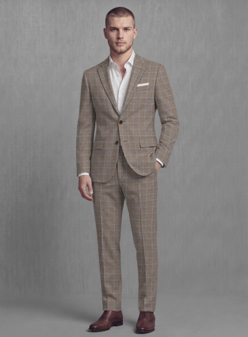 Man wearing a mocha brown check soft tweed suit with light blue windowpane, front view