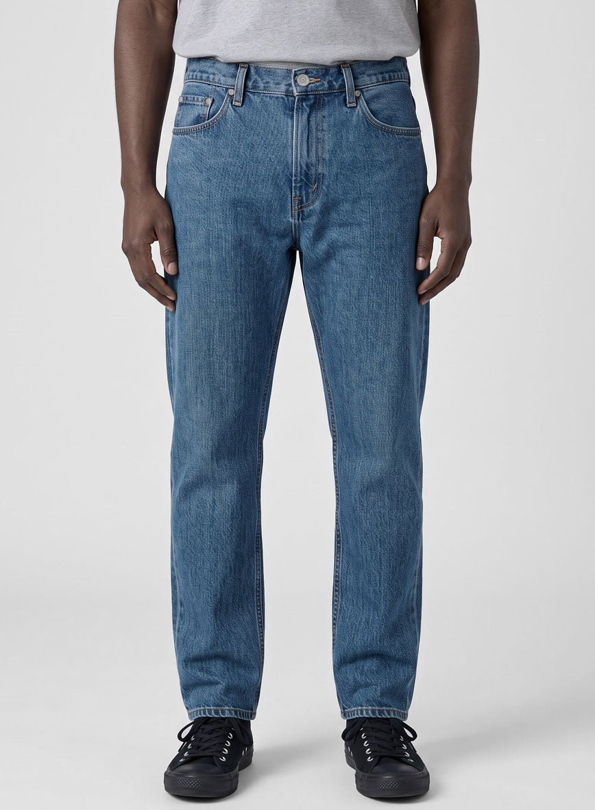 Front view of light blue slight stretch jeans on a man, waist to hem